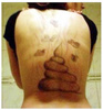 Тату-мастер сделал неверной девушке прощальный подарок в виде татуировки «в стиле фэнтези» на всю спину