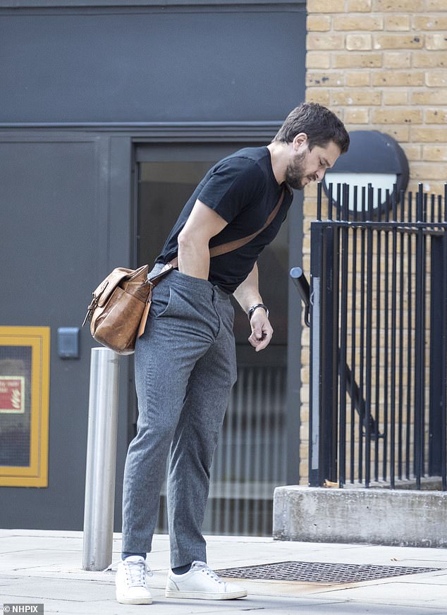 Down he goes: He added white trainers to his smart casual look on Saturday