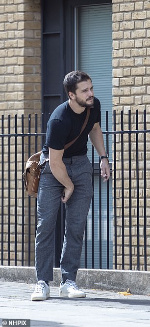 In the way! He slung a tan leather messenger bag across his torso