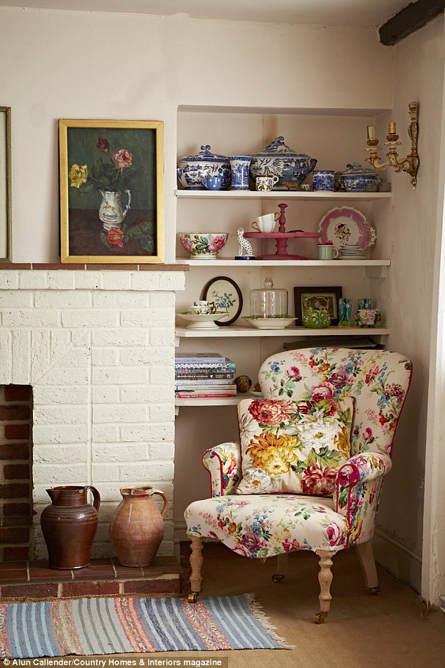 The fireplace was a red-brick monstrosity, which Sarah transformed with a pot of Clunch by Farrow & Ball (farrow-ball.com). ‘The cottage is Grade II listed so we’ll look into replacing the fireplace with a more suitable style,’ she says. ‘But, for now, this works.’ The runner is from Stable Antiques in Storrington (stableantiques.co.uk). For similar pictures, visit Vintage Flower Paintings (vintageflowerpaintings.com)