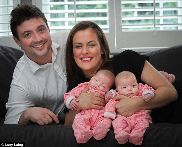 Identical twin Michelle  Cooke with husband Pete and their identical twins Elsie (left) and Marnie (right)