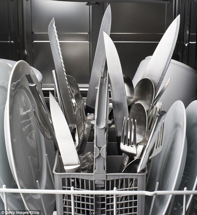 Experts say to never put your sharp kitchen knives in the dishwasher, as pictured, as the corrosive detergent and heat can blunt the blade